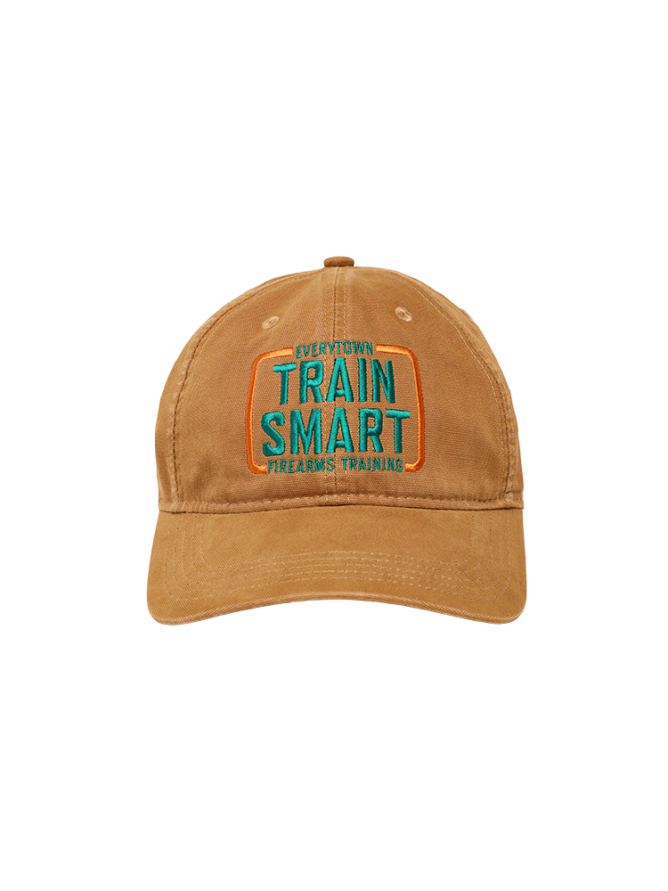 Front view of light brown Carhartt canvas baseball cap with embroided orange and teal logo that reads: TRAIN SMART Everytown Firearms Training.