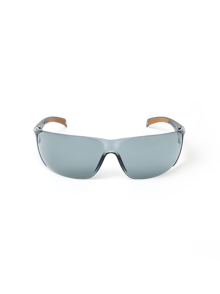 Front view of gray-tinted Carhartt Billings safety glasses with a small white Train SMART logo on each side.
