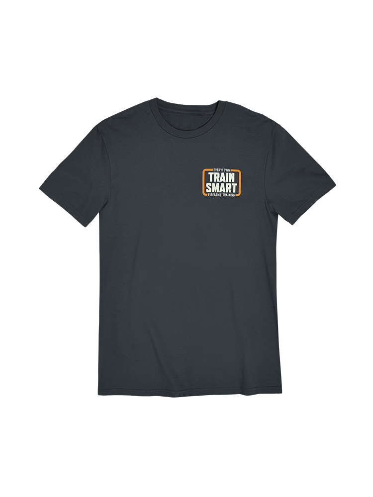 Front view of gray short sleeve unisex t-shirt with a small orange and white logo on left chest that reads: TRAIN SMART Everytown Firearms Training.